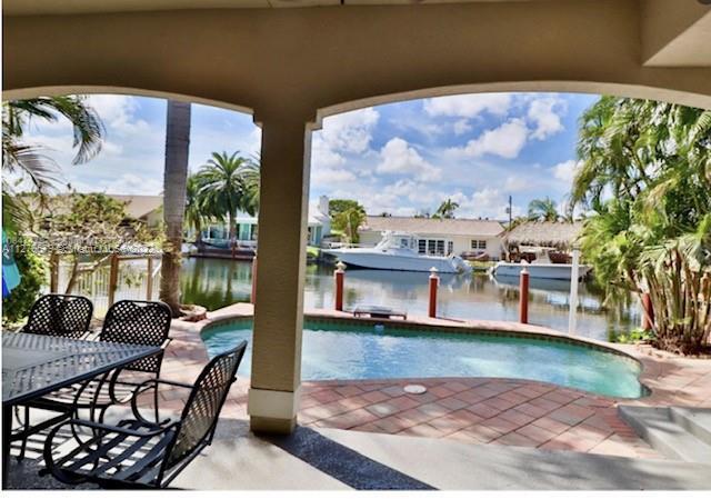 Spectacular waterfront two stories home in desirable Snug Harbor in Pompano Beach, 4 bedrooms & DEN,