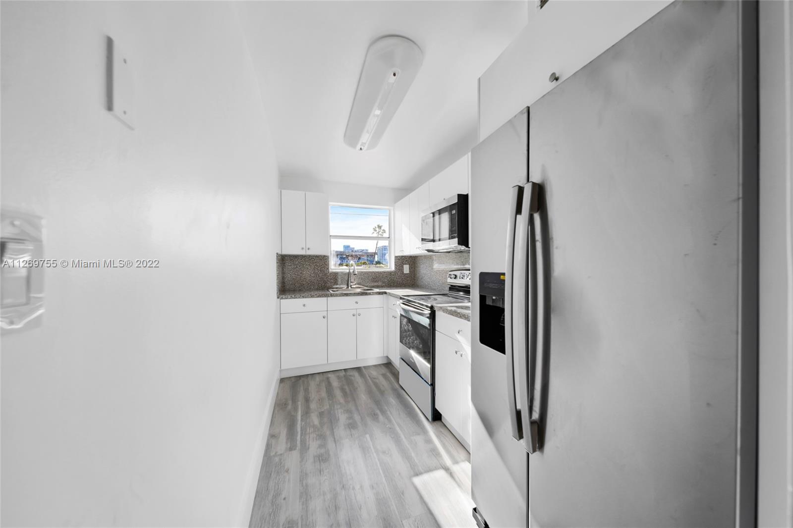 Bright and spacious corner unit in South Beach. Unit features Gray wood like vinyl plank floors thro