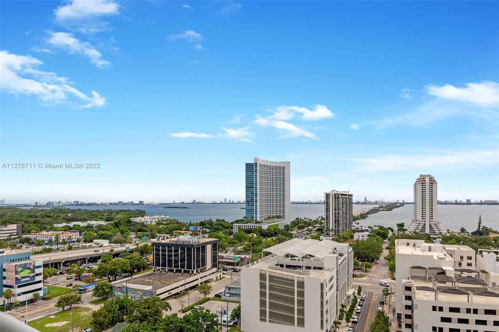 Stunning 1BD/1.5BA unit with breathtaking Bay & City views in prestigious Midtown Miami. Open floor 