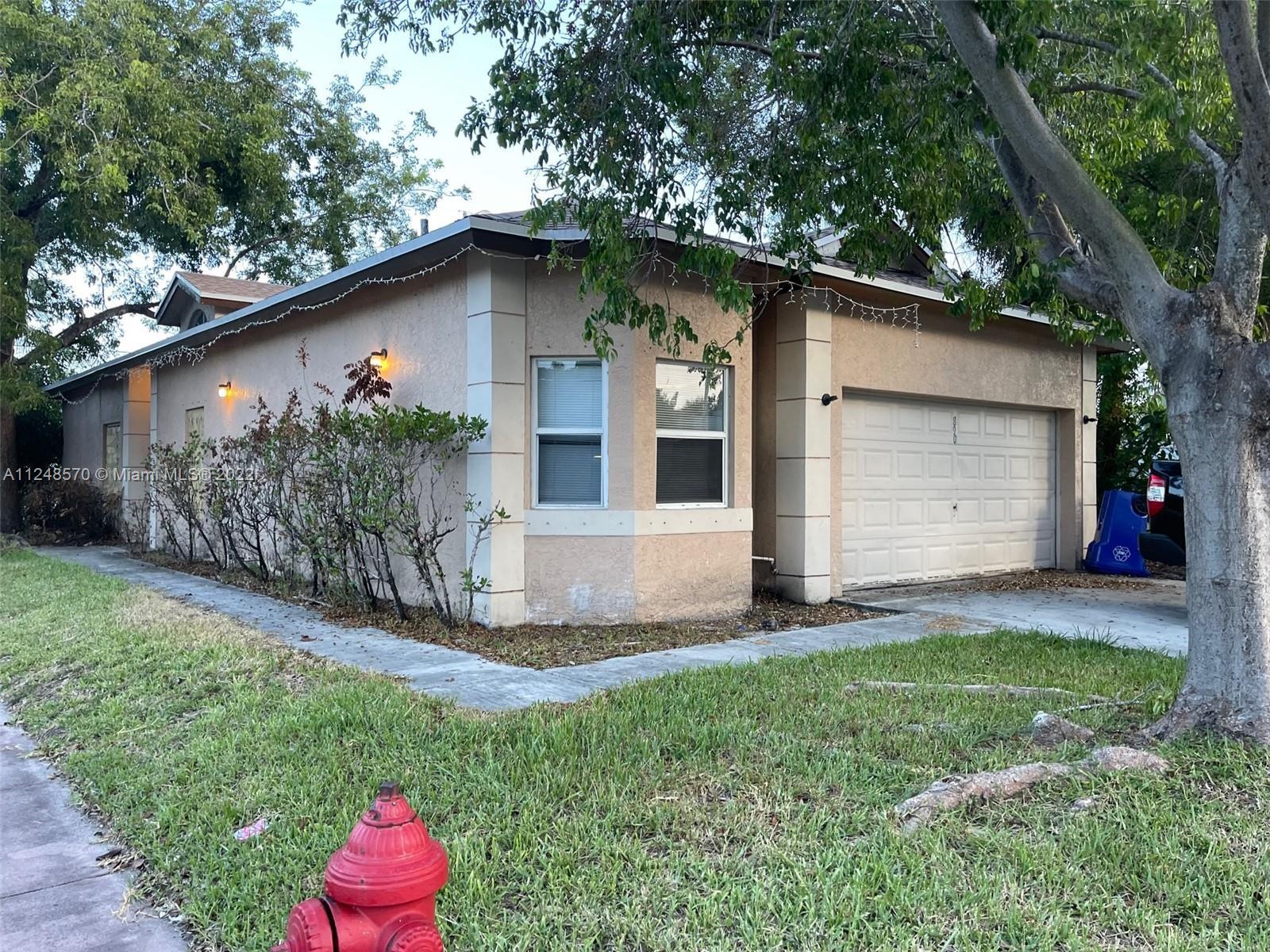 Charming three bedroom two bathroom home on a corner lot. With vinyl floors throughout, living, dini