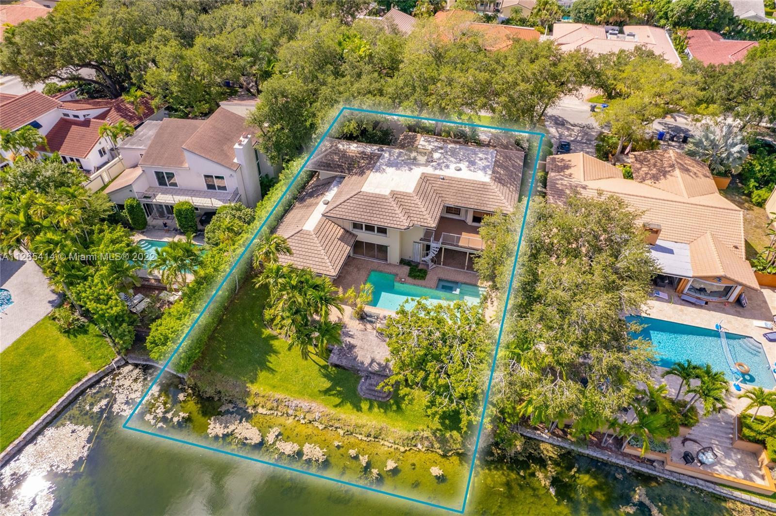 Absolutely gorgeous, beautifully landscaped 4 BD / 3.5 BA lakefront pool home in exquisite Lakes of 