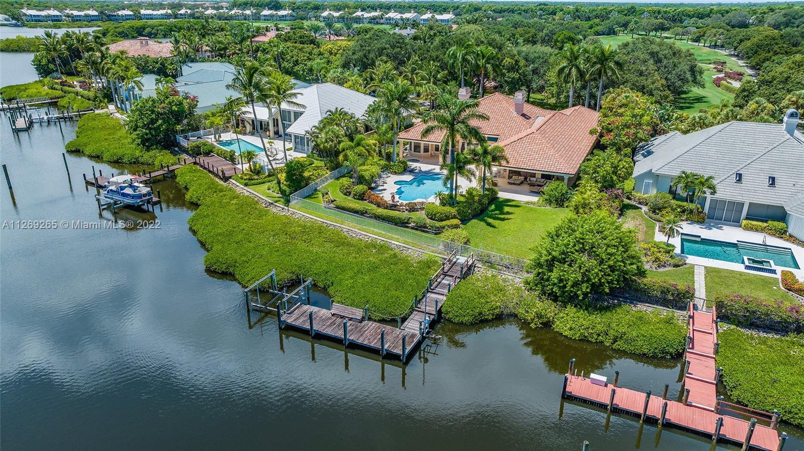 Custom Waterfront Estate Home with convenient location close to the main gate and clubhouse. If you 