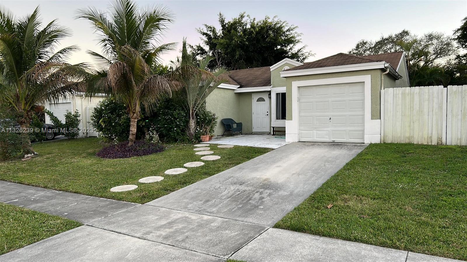 2 beds 2 bath HOME in desirable west Boca Raton neighborhood. LARGE FENCED BACK & SIDE YARD with a c