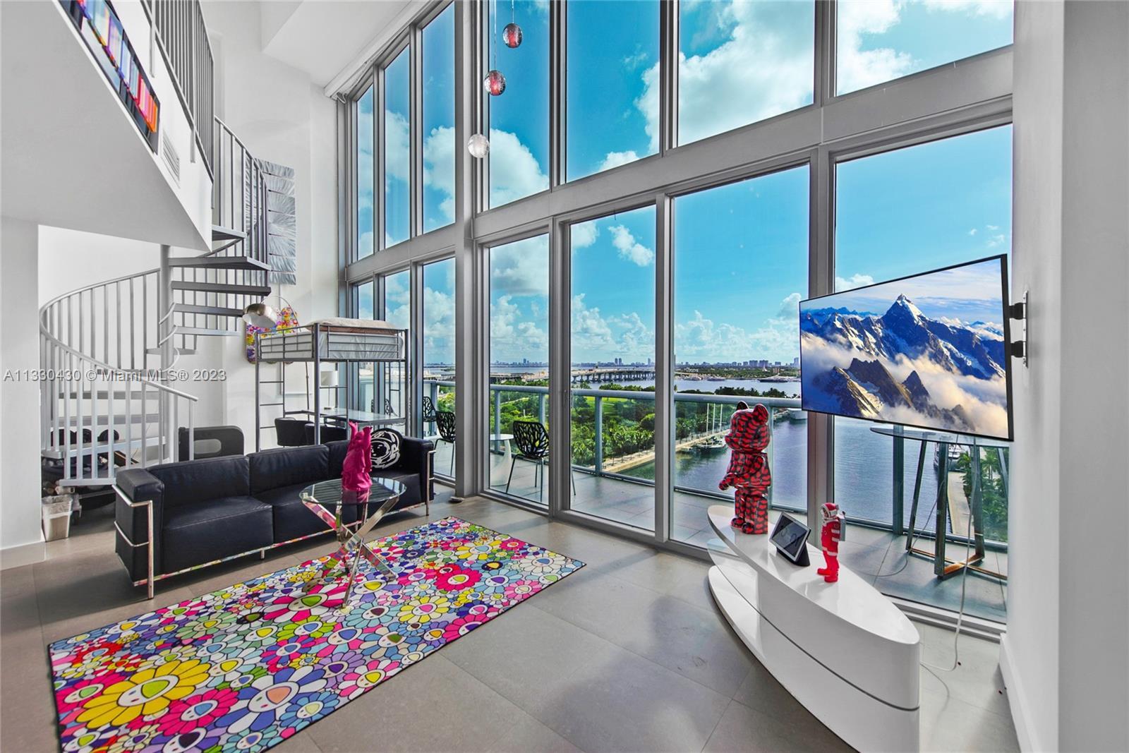 Spectacular direct water views throughout this 2-level residence in Marina Blue, a luxury building i