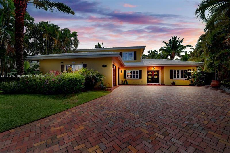 Beautifully updated grand home located in sought after East Boca neighborhood on a cul-de-sac. This 