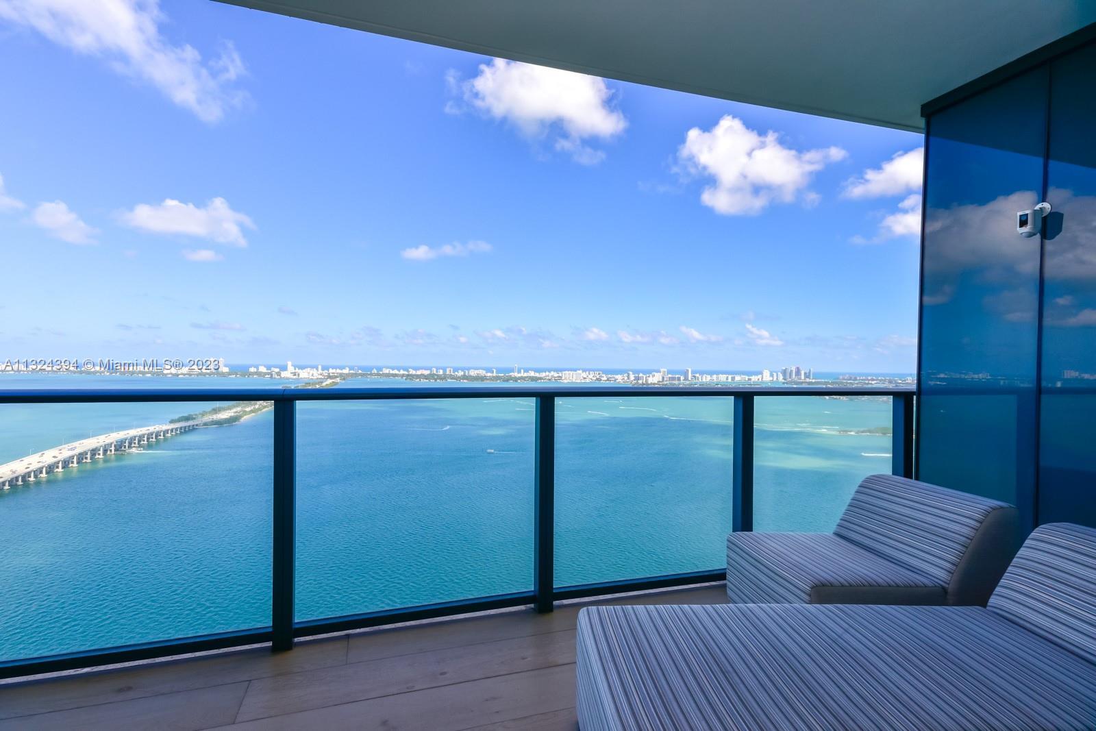 Spectacular corner unit at One Paraiso with unobstructed views of Biscayne Bay. This 3-bedroom, 3.5 