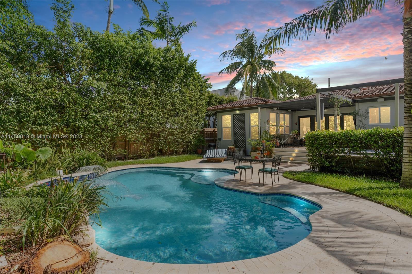 This charming 3 bed + office, 3 bath Mediterranean home is the epitome of lush Miami Beach living. A