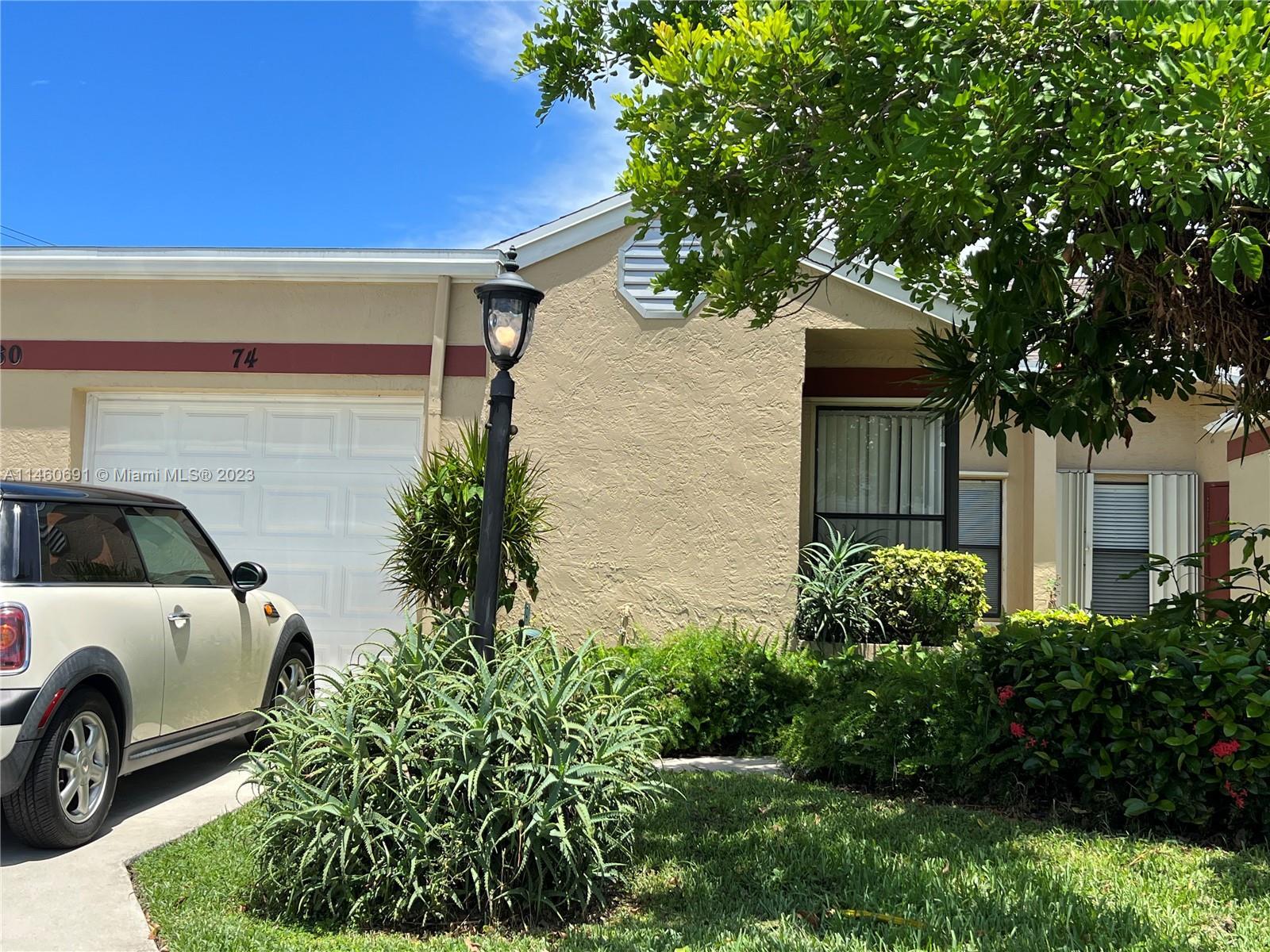 Nice single-story villa, hard to find featuring a rare, attached garage, boasting lofty vaulted ceil