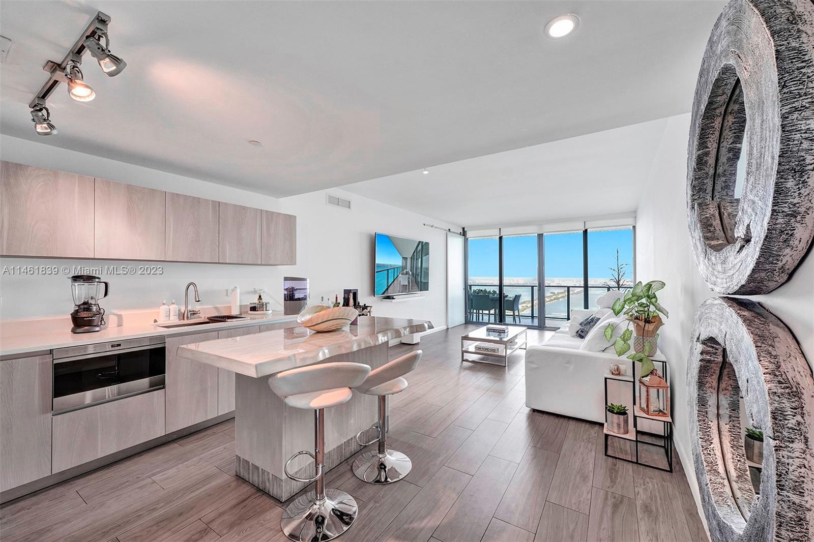 This gorgeous 47th floor 3 bdrm/3.5 bath with den condo has one of the best views Miami has to offer