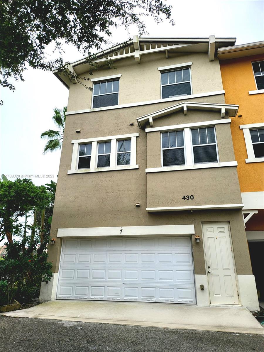Beautiful 3-Level Townhome nestled within an exclusive gated community in the prestigious West Palm 
