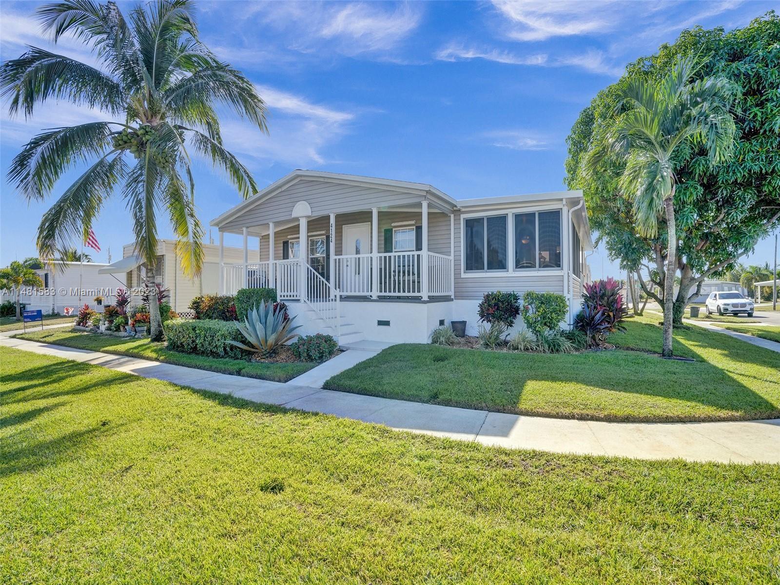 This is a stunning and spacious 3-bedroom, 2-bathroom manufactured home that sits on a fantastic cor