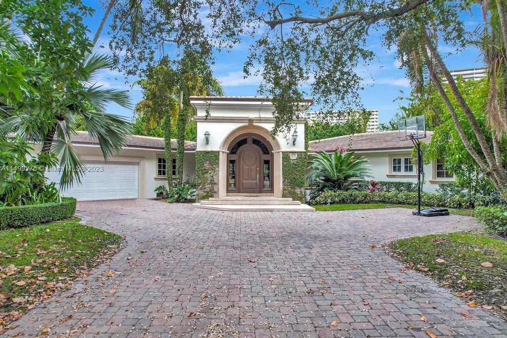 Rare opportunity to live in the exclusive guard gated Bal Harbour Village on an oversized (17,500 sq