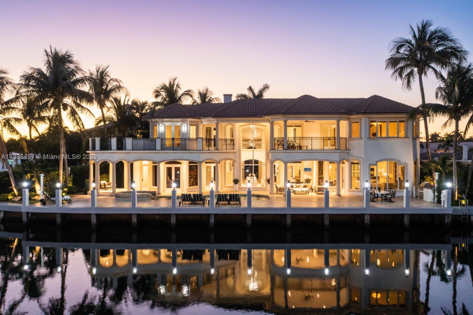 Breathtaking, one-of-a kind villa on a prime waterfront point-lot in prestigious & secluded Boca Bay