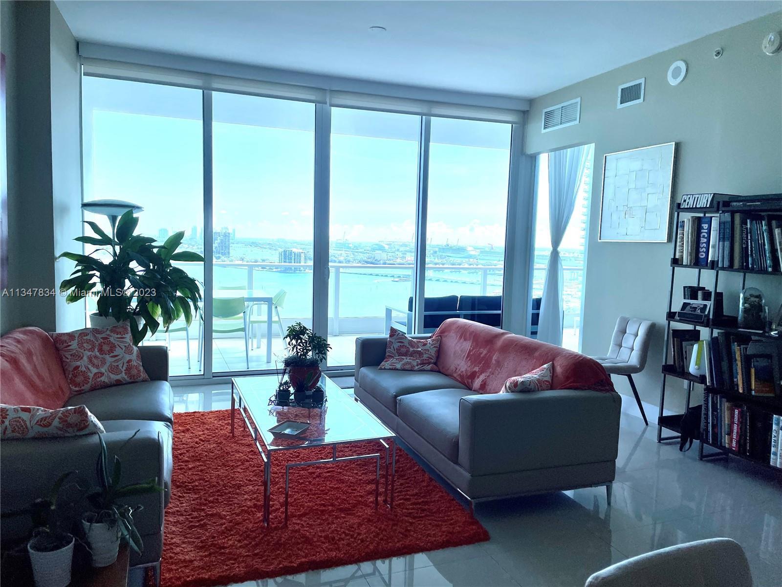 Beautiful flow through unit with unobstructed view facing bay and ocean on a large terrace at east s
