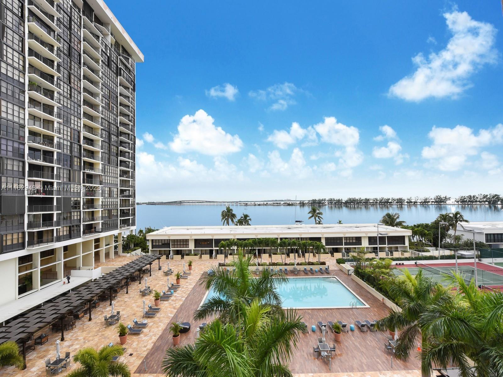 This bayfront unit at Brickell Place Phase I on Biscayne Bay has been expertly renovated, offering s