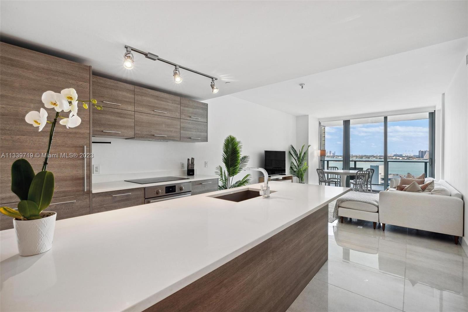 DIRECT BAY VIEWS from this 2BED/3BATH+DEN at the amazing PARAISO BAY offering the best amenities in 
