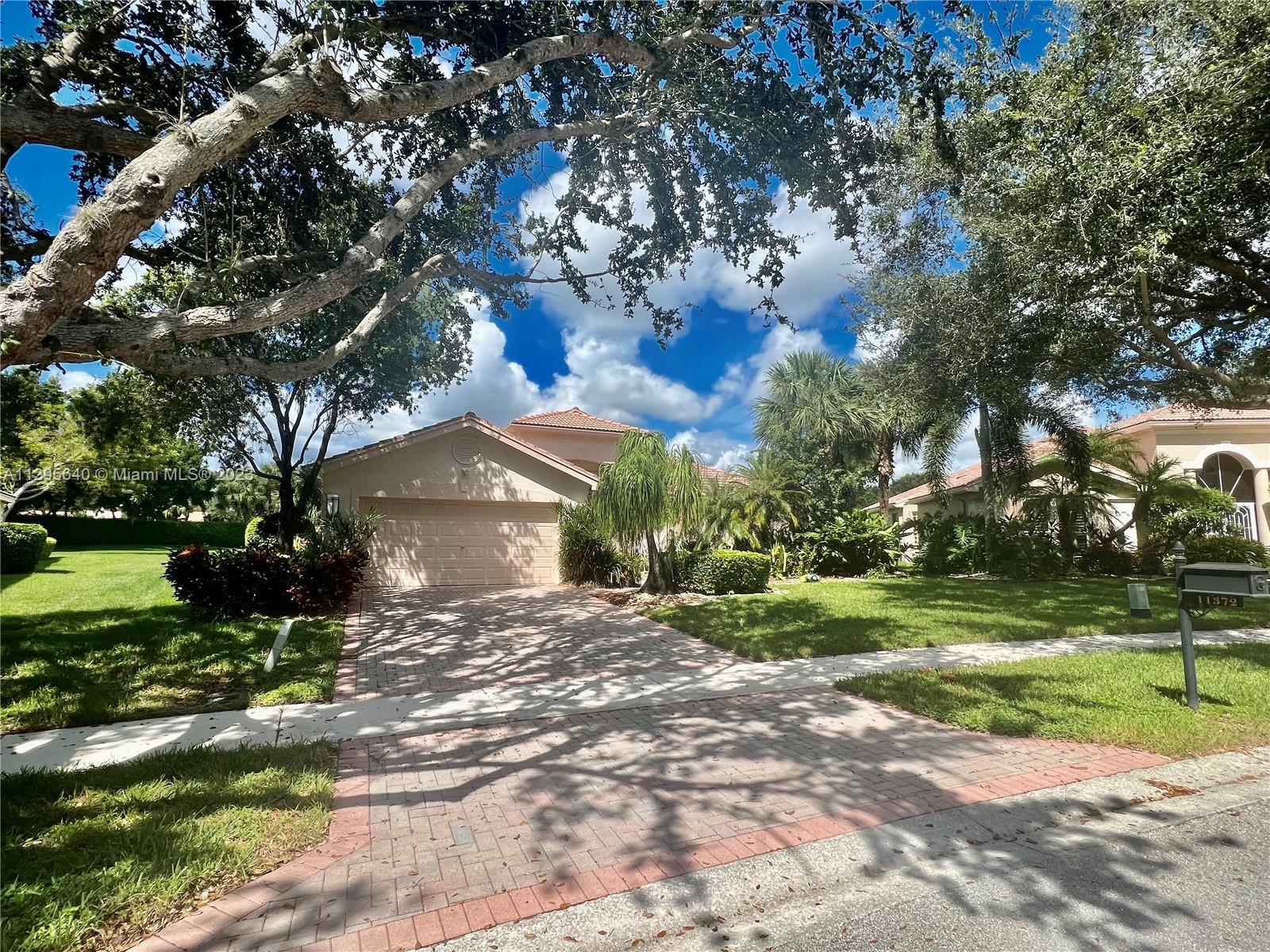Beautiful well kept pool home on one of the largest lots in Valencia Isles 16,899 SF. This is a 55+ 
