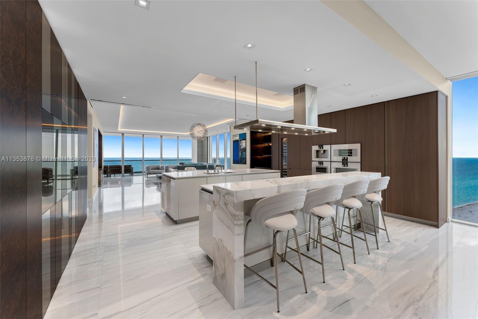 This luxurious, one-of-a-kind 4 bedroom, 4+1 half bathroom home in the sky at the coveted Turnberry 
