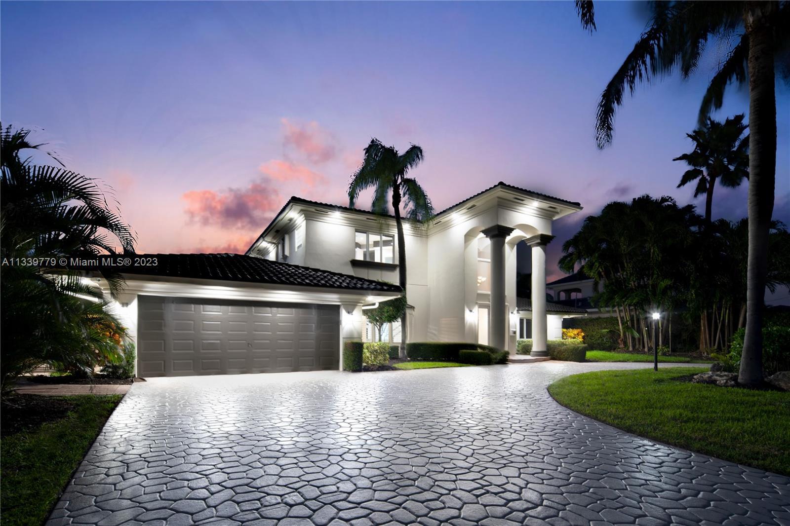 Fully transformed in 2022 into a luxurious waterfront home with contemporary design & 100 feet of wa
