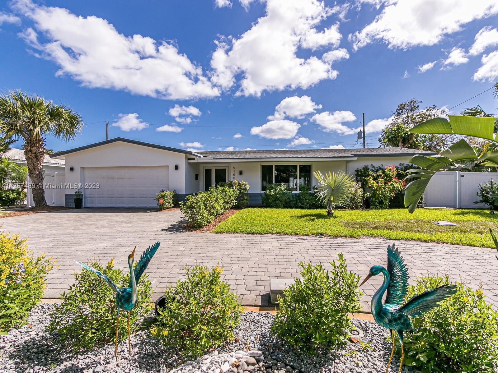 GORGEOUS HEATED POOL home in the desirable Coral Ridge Isle neighborhood only 2.1 miles to the beach