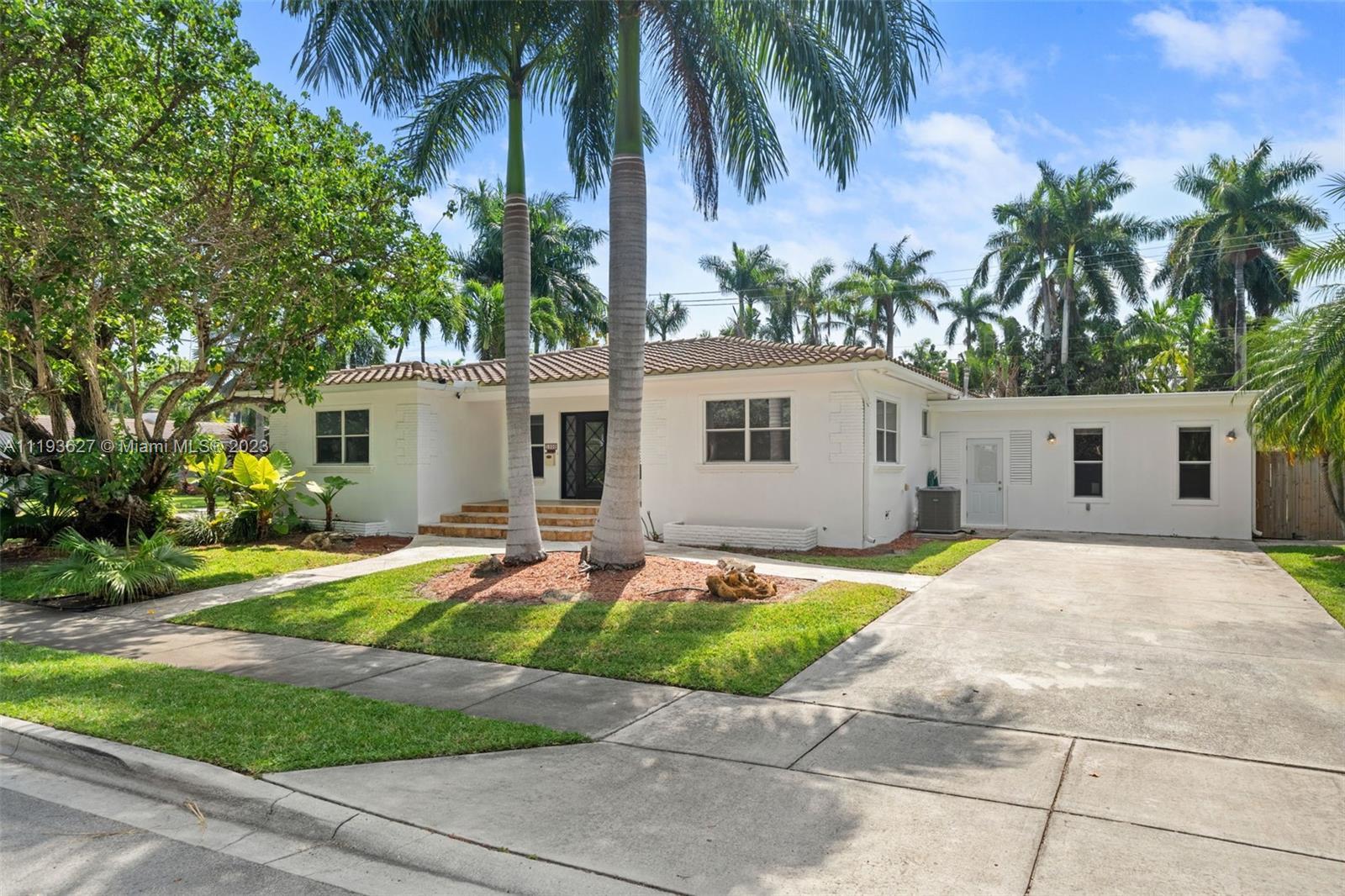 This 3  bedroom, two and one half bathrooms home boasts a pool, large enclosed porch and space for b