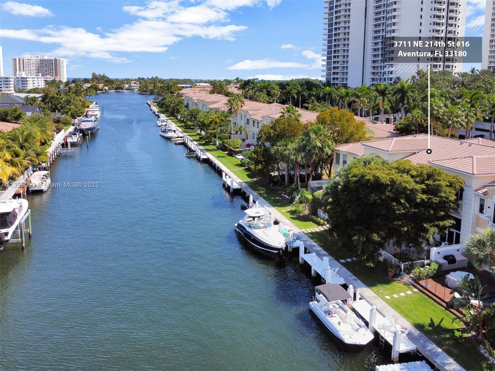 ELEGANT BOATERS PARADISE WATERFRONT TOWNHOME WITH NEW HIGH-IMPACT WINDOWS THROUGHOUT THE HOUSE, LOCA