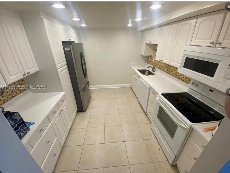 Welcome to your new home in Hallandale Beach, Florida! This spacious 3 bedroom, 2 bathroom condo is 