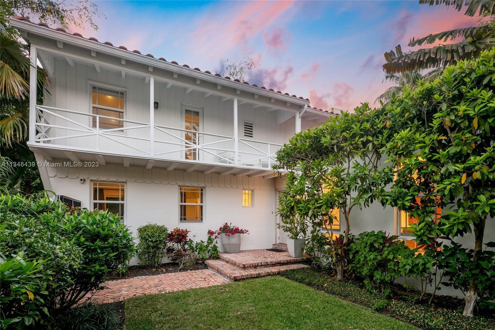 Tucked behind lush landscaping, this fully renovated Miami Beach Bungalow exudes charm & features va