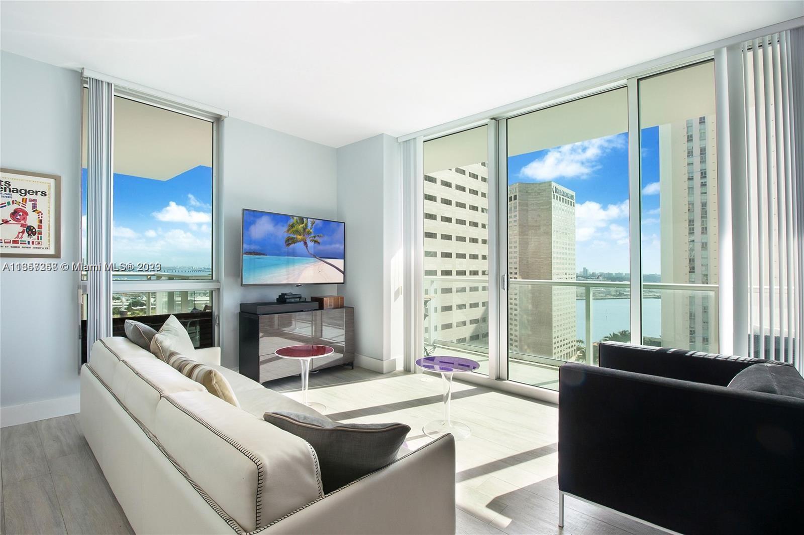 Fabulous water and city views from this spacious 2 Bedroom/2 bath split plan, corner unit. Tile floo