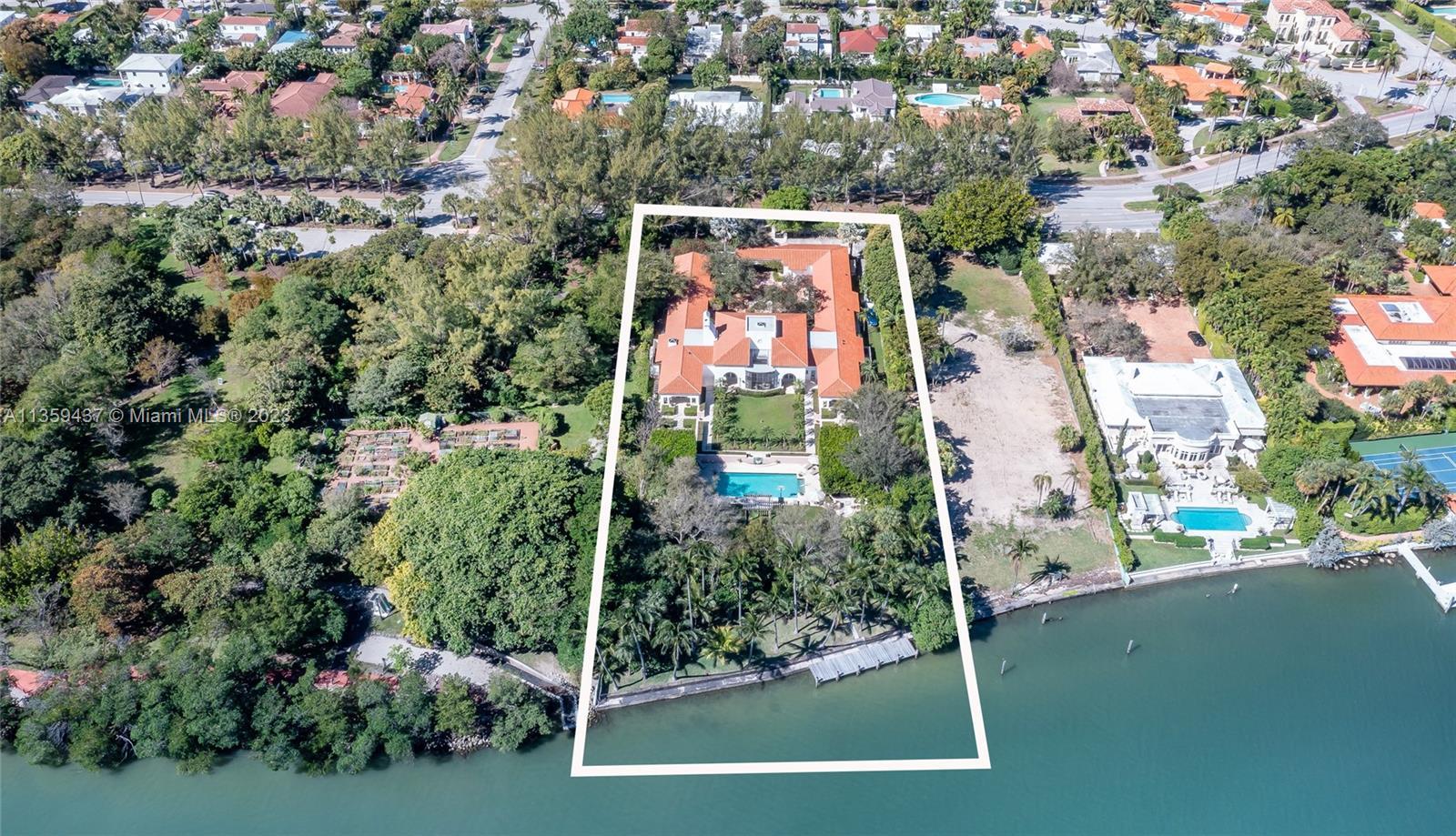 Nestled on a sprawling 1.3-acre waterfront lot, this magnificent Miami Beach property offers endless