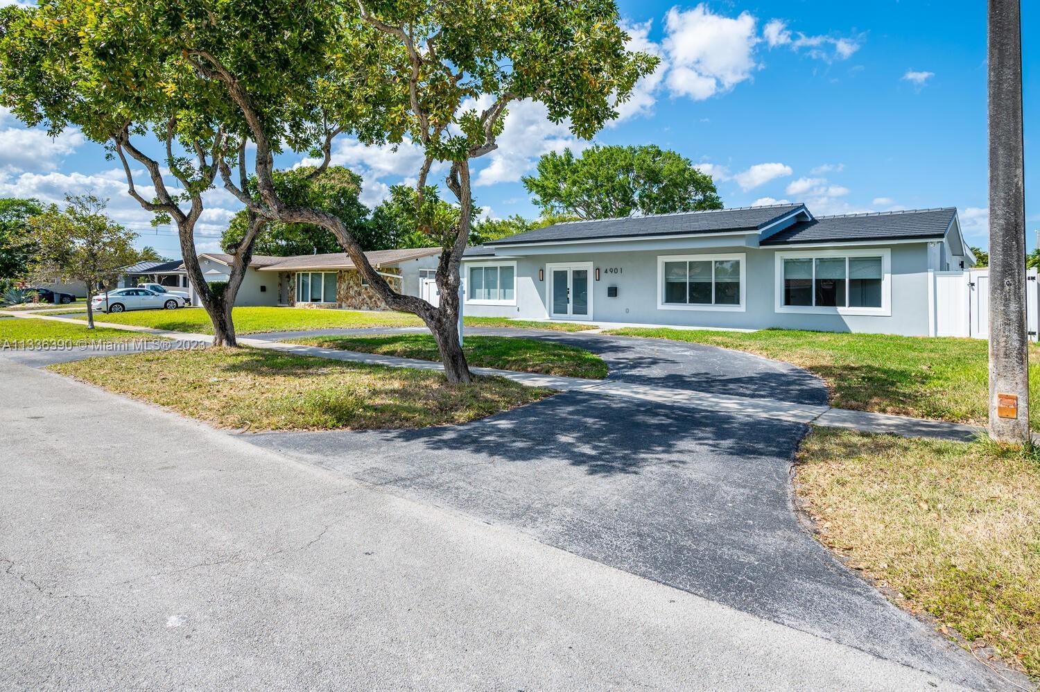 THIS RECENTLY COMPLETE REMODELED RESIDENCE (turn Key) in Hollywood. NO EXPENSES WERE SPARED. Come se
