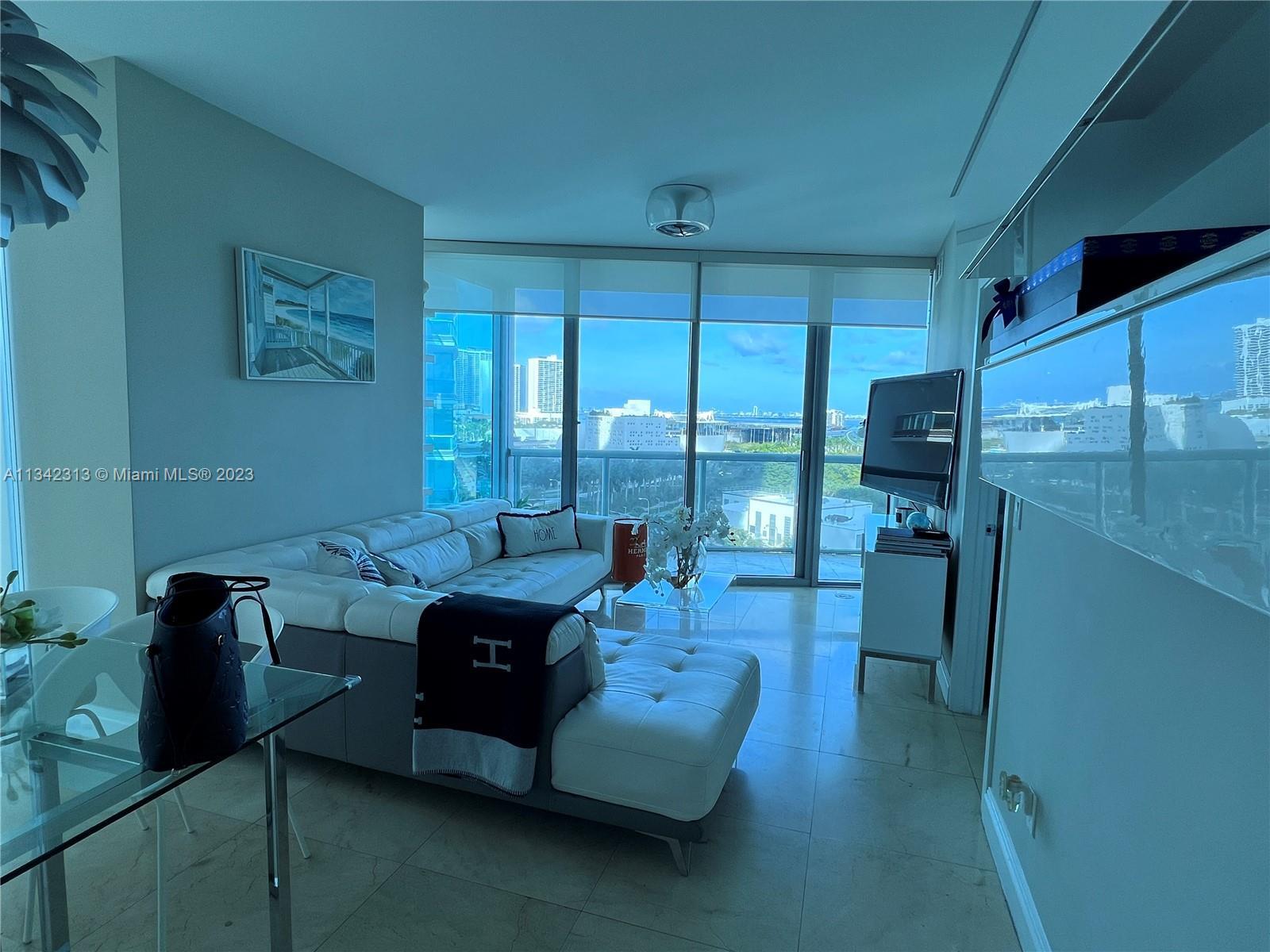 Bayfront corner large 1327 SF 2/2 @ Marina Blue w/wrap around floor to ceiling windows & marble floo