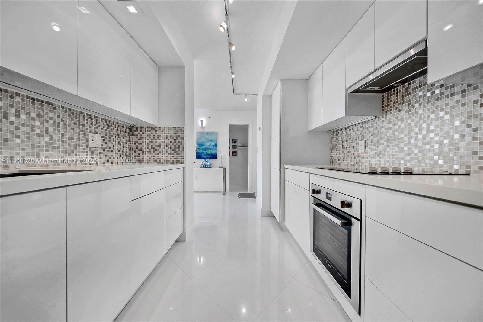 Unique, completely renovated condo using the finest materials at The Collins condominium. Ultra-mode