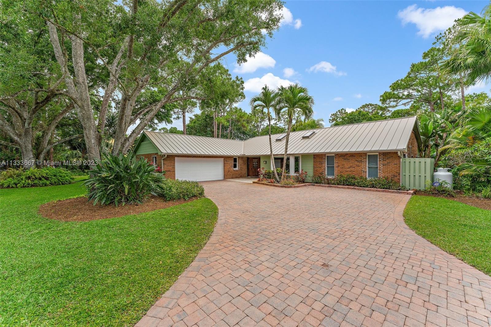 Private and quiet, this 3 bedroom, 2.5 bathroom pool home with a guest cottage in the Trailwood comm