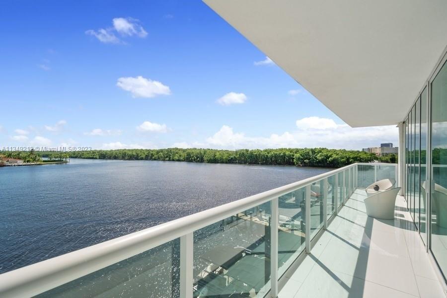 Corner unit Truly "on the water" 3 Bed 2.5 bath in Sunny Isles with floor to ceiling windows in all 