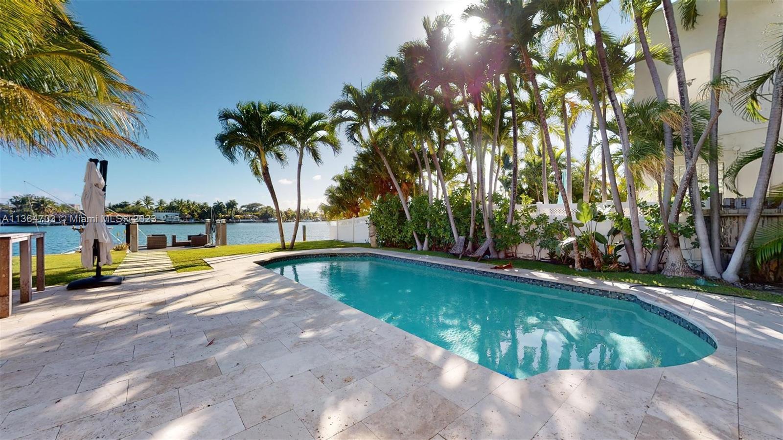 Beautiful and spacious wide view waterfront home in coveted Surfside. This home has an open floor pl