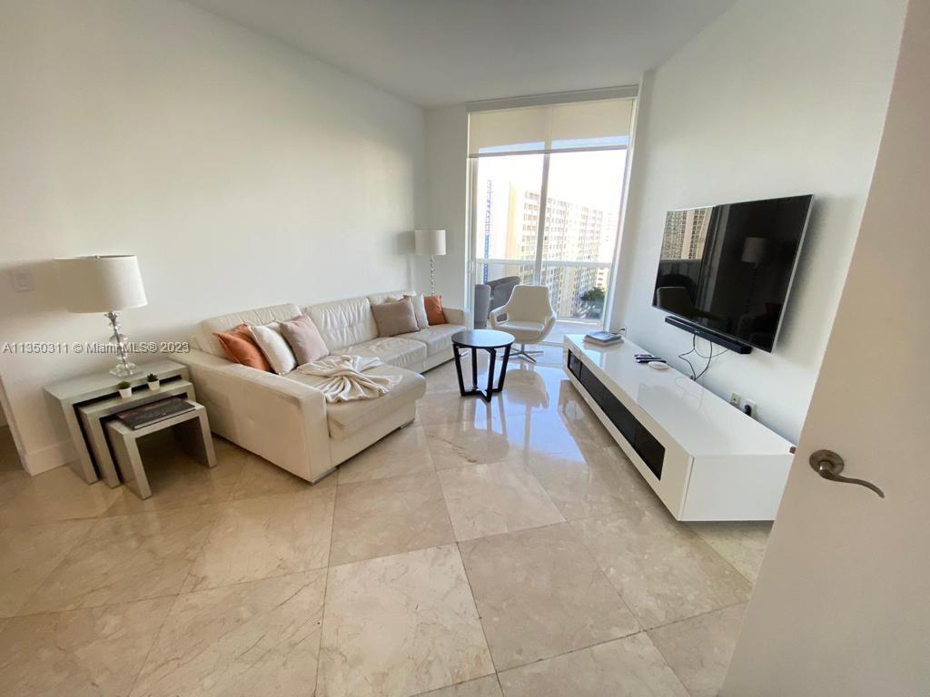 This immaculate 2-bedroom/2-bathroom unit in Trump Tower I Sunny Isles showcases breathtaking intrac