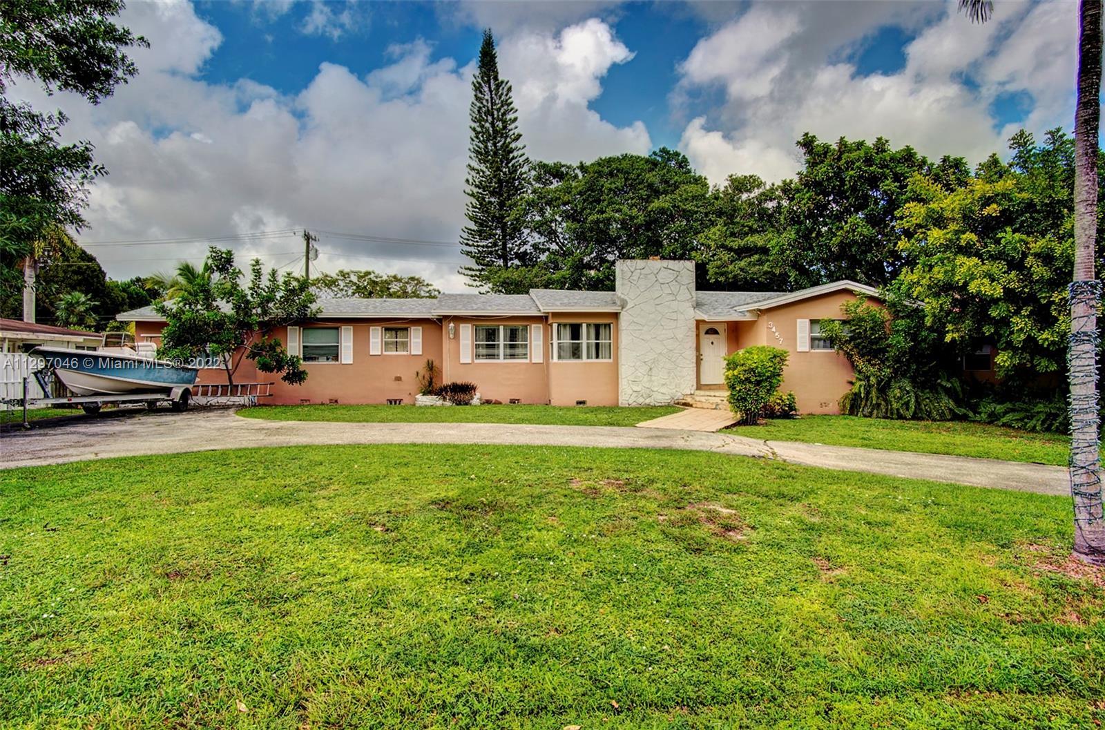This Hollywood Hills 3 Bedroom 2 Bath home with a very large fenced yard sits on a 12,000+ Sq Ft.  L