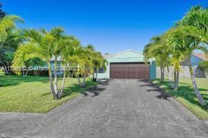 Location, Location, Location.  4 Bedrooms, 2 1/2 Bath and  pool home  with solar panels, walk-in clo