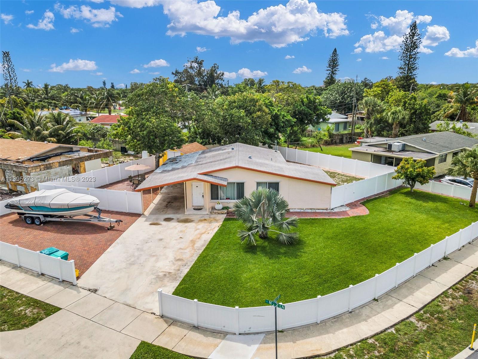 Welcome to this charming 3-bedroom and 2-bathroom corner house located only 1.5 miles away from the 