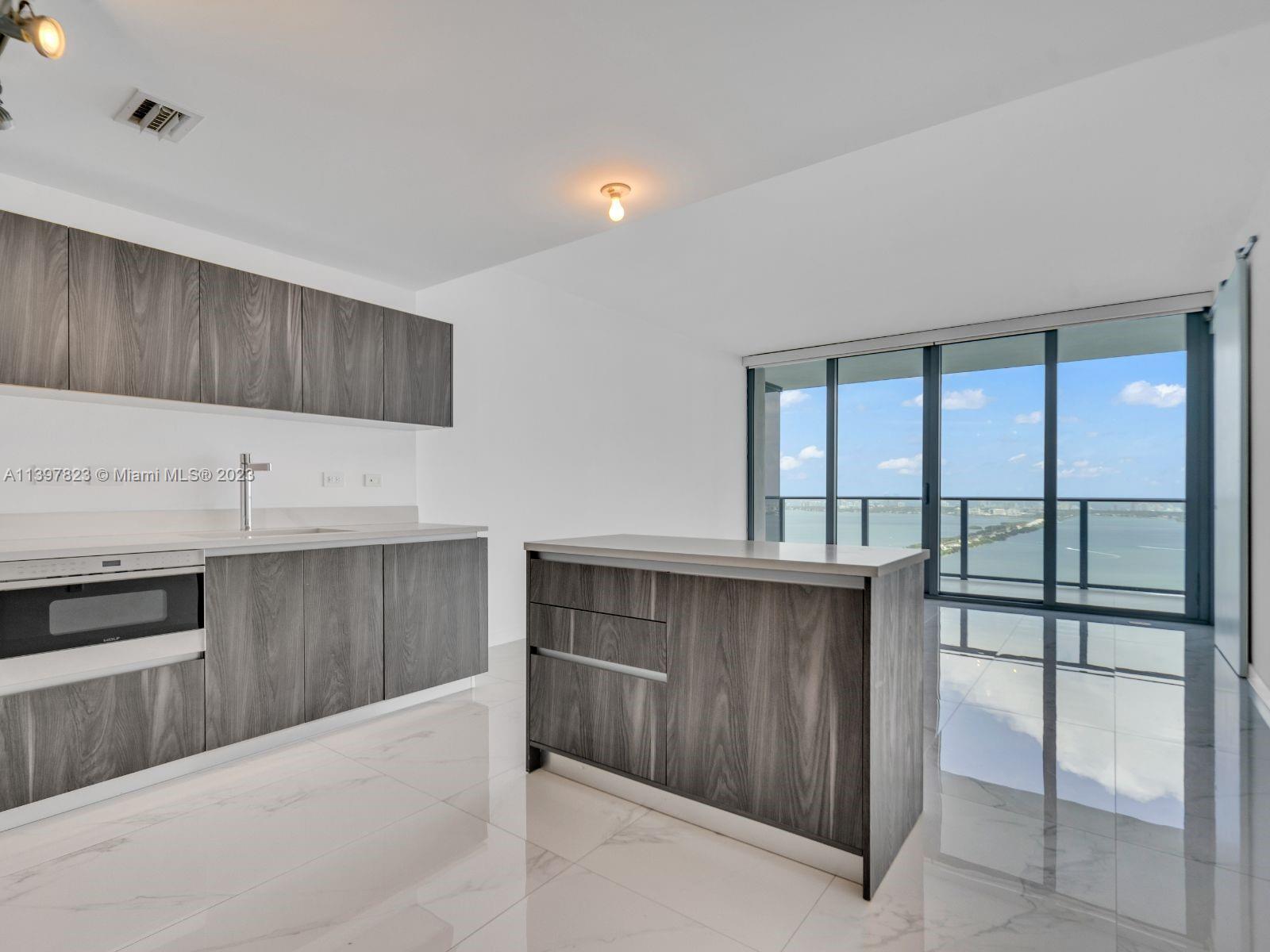Enjoy living on the direct bay view luxury unit , featuring marble floors, floor to ceiling impact w