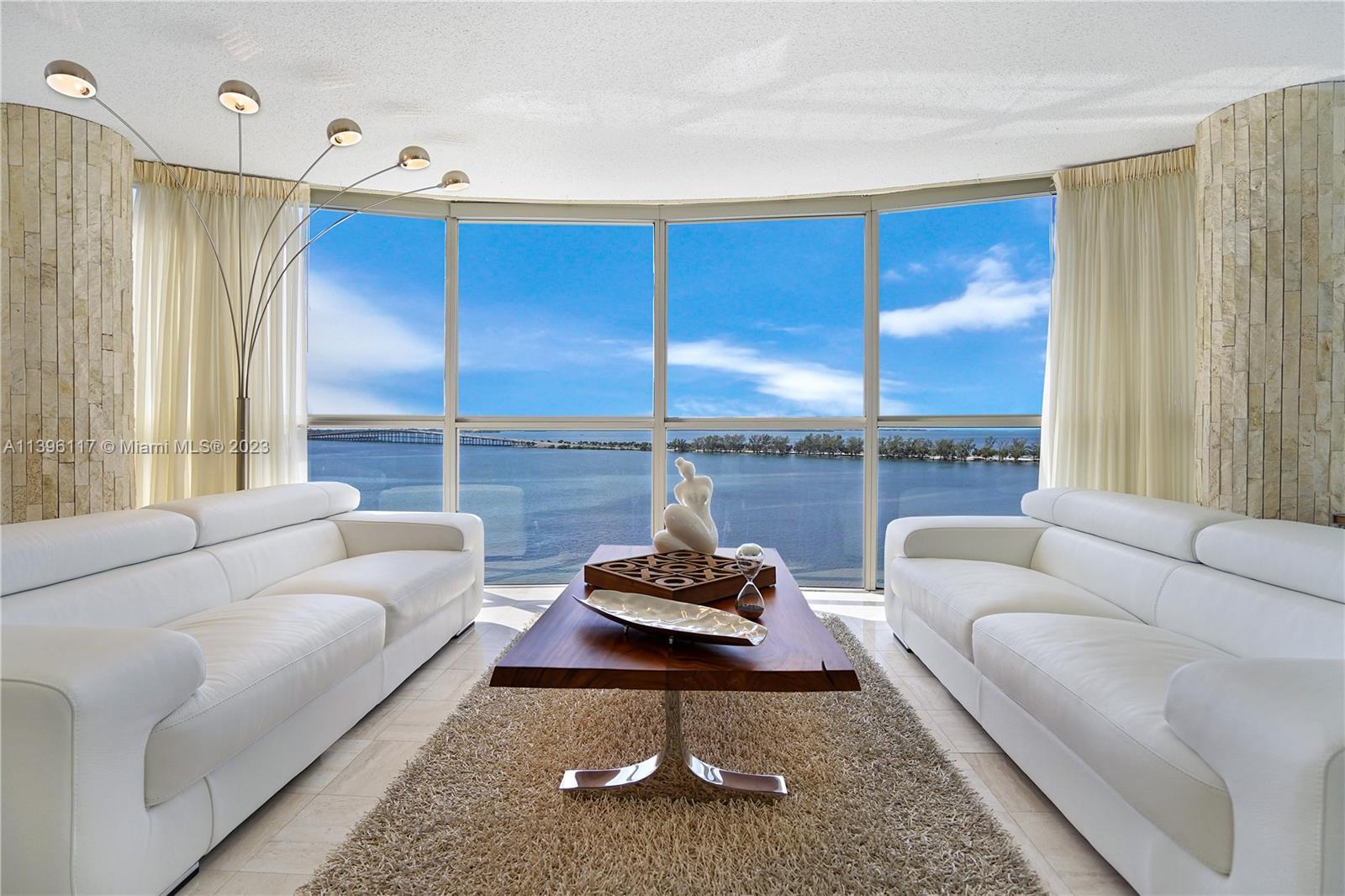 Breathtaking 180 degrees of uninterrupted views of the Biscayne Bay landscape from the living-dining