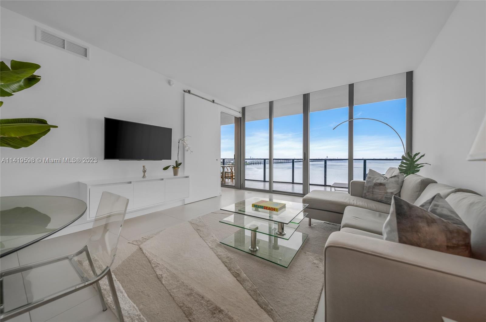 Gorgeous 1 bed plus den/1.5 bath condo in the Heart of Edgewater has a multi-million dollar, unobstr