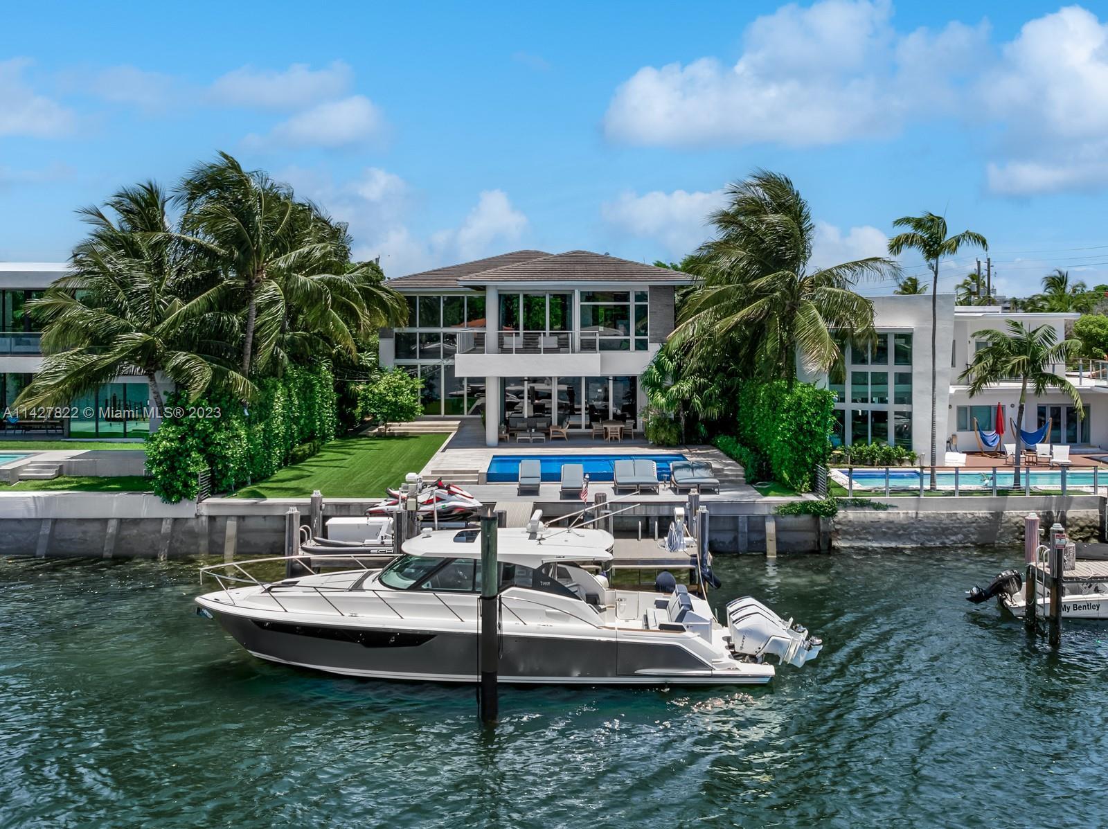 Remarkable turn-key waterfront residence located in the gated community of Biscayne Point. This exqu