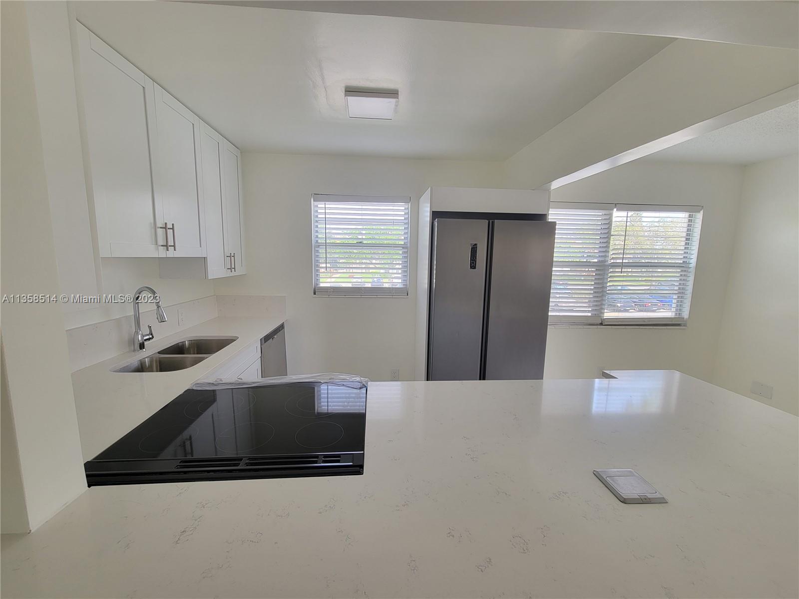 INVESTORS OPPORTUNITY or OWNER OCCUPIED .Renovated bright, corner unit with garden view. Best locati
