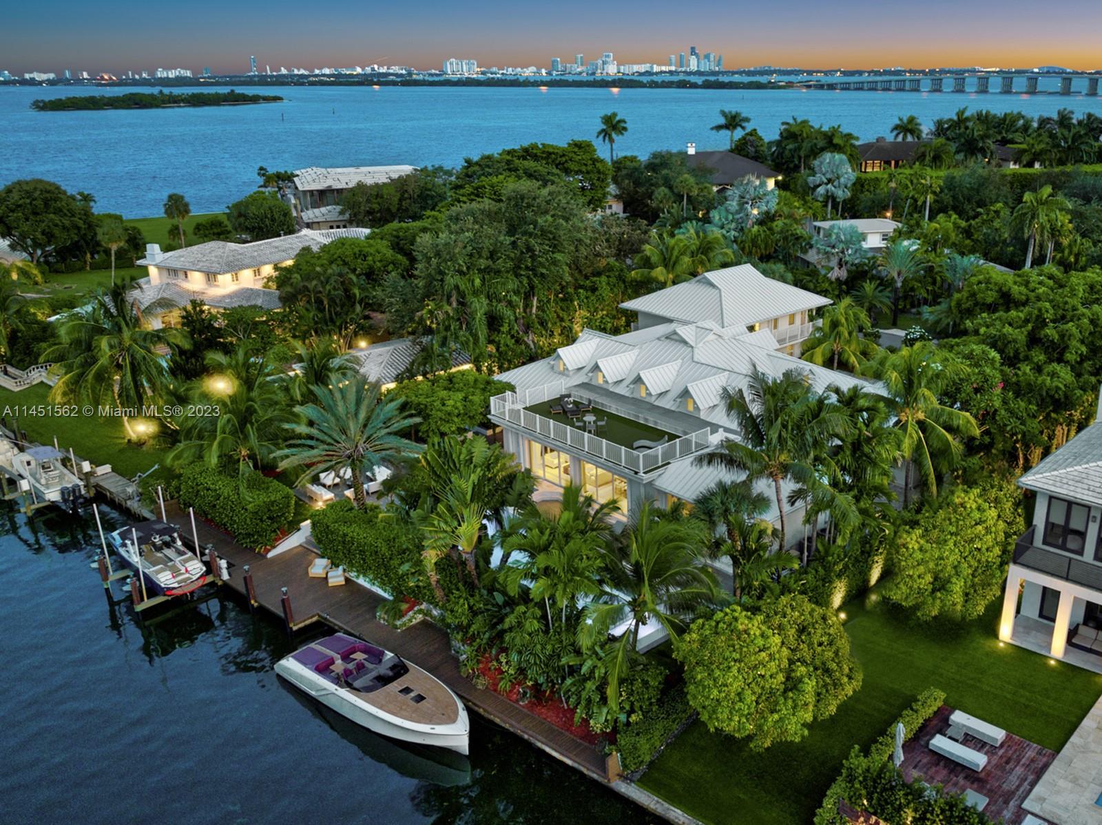 Welcome to Casa Aqua! This boater’s dream modern-Island waterfront residence boasts 120 ft of water 