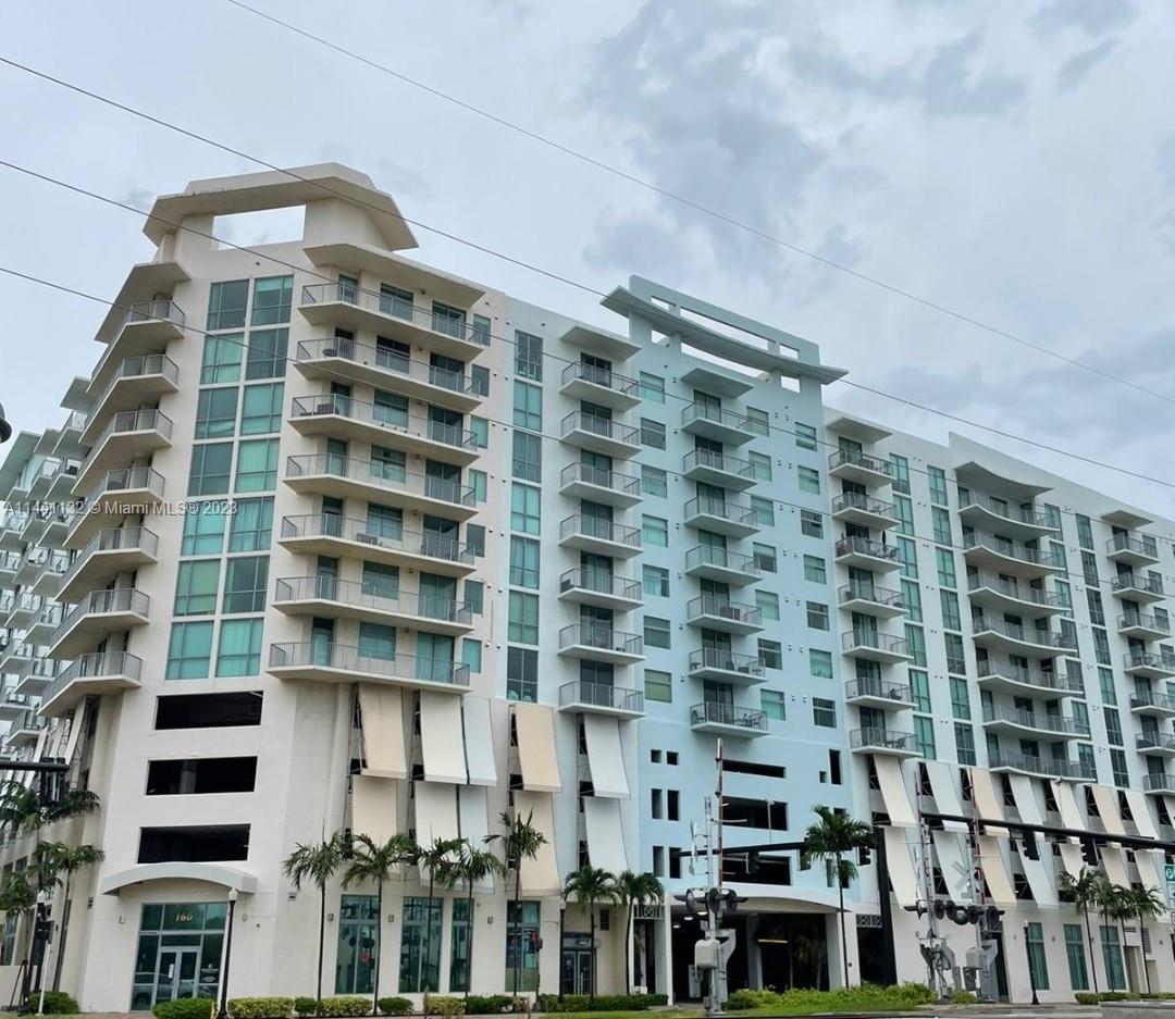 Spacious two bedroom split plan condo with impact glass and lots of light. European cabinets and gra
