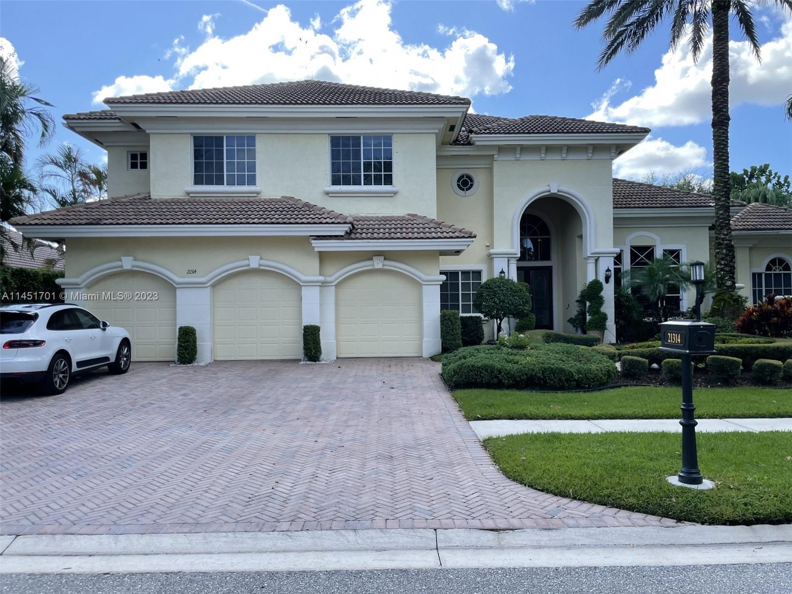 This exquisite home situated on the sixth fairway of Boca Grove is truly one-of-a-kind. It offers fi