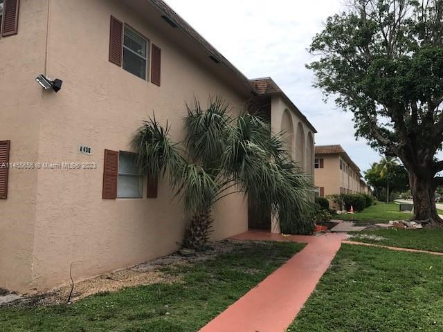 SPACIOUS 2 BEDROOM, 1 BATH CONDO ON 2ND FLOOR WITH LAMINATE FLOORS, NEWER FRIDGE AND GLASS TOP STOVE