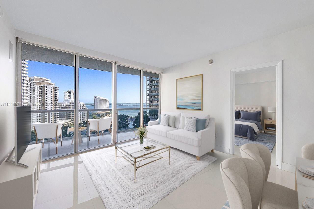 Elegant 2-bedroom, 2-bathroom + den 1,313 SF unit in the desirable Icon Brickell condominium, with e